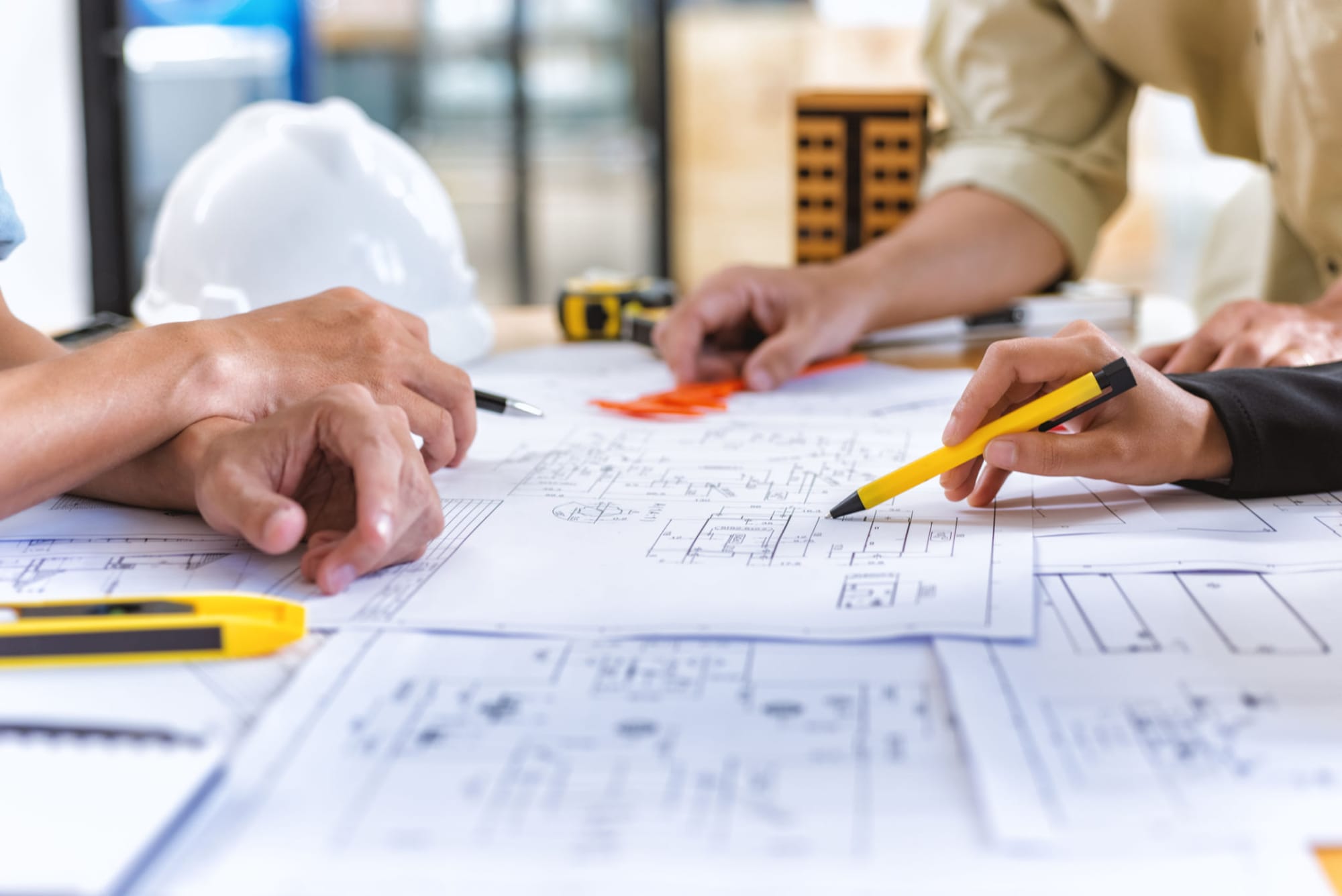Engineers reviewing detailed network plans